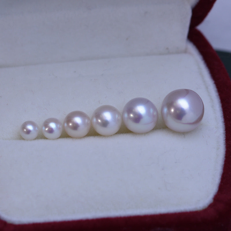 “Pearl Aura” White round Pearls