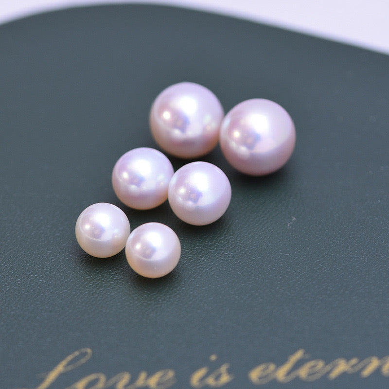 “Pearl Aura” White round Pearls